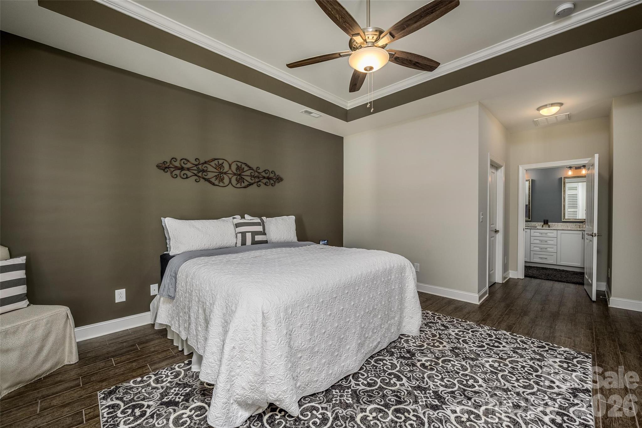 16215 Lakeside Loop Lane Cornelius, NC 28031 - Photo 28 of 48 a bedroom with a large bed and a chandelier