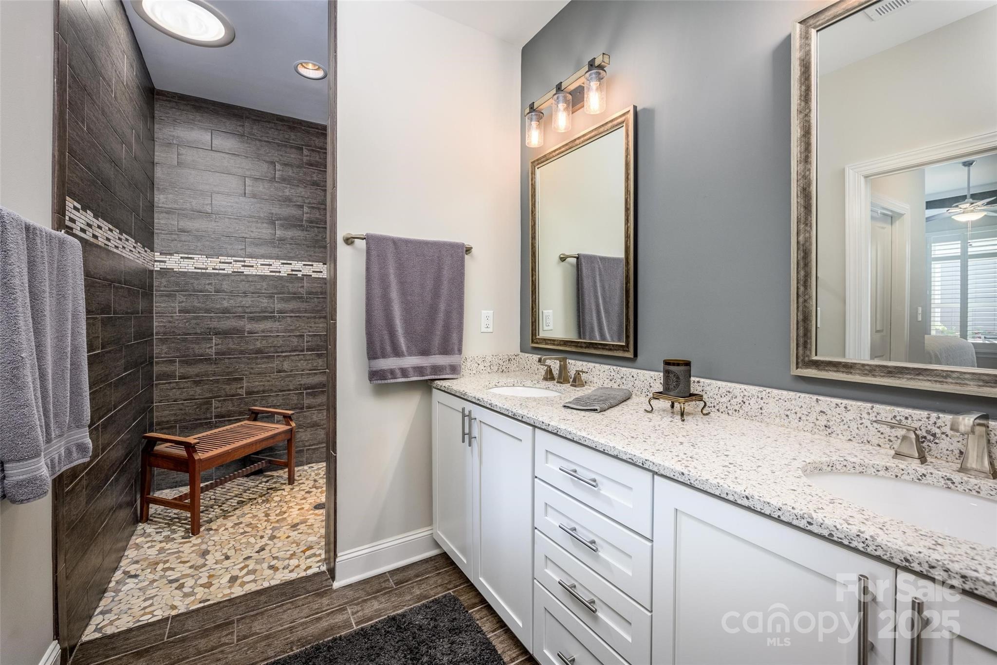 16215 Lakeside Loop Lane Cornelius, NC 28031 - Photo 31 of 48 a bathroom with a granite countertop sink and a mirror