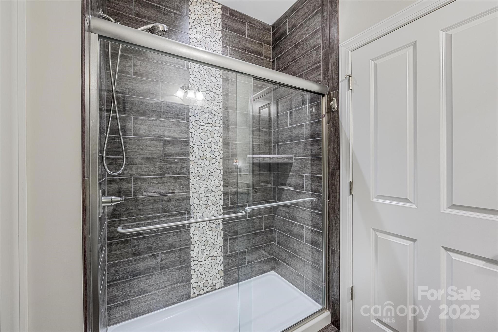 16215 Lakeside Loop Lane Cornelius, NC 28031 - Photo 35 of 48 a bathroom with a shower