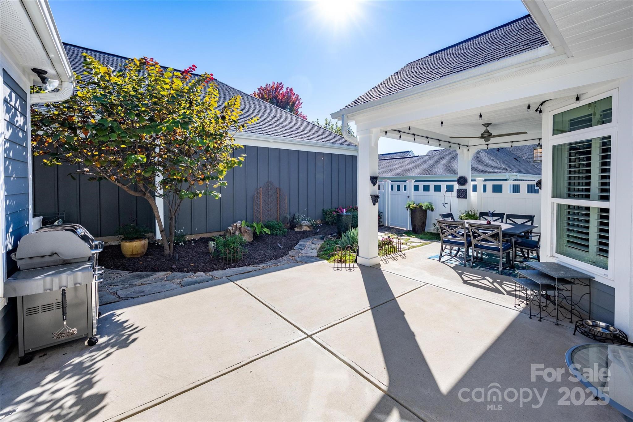 16215 Lakeside Loop Lane Cornelius, NC 28031 - Photo 4 of 48 a view of a chairs and tables in the patio