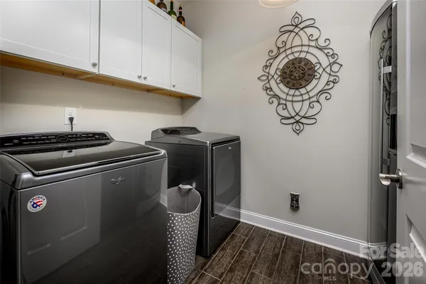 a room with a stove and a refrigerator