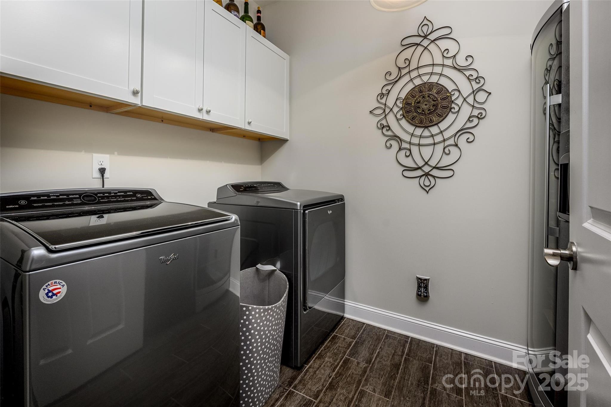 16215 Lakeside Loop Lane Cornelius, NC 28031 - Photo 42 of 48 a room with a stove and a refrigerator