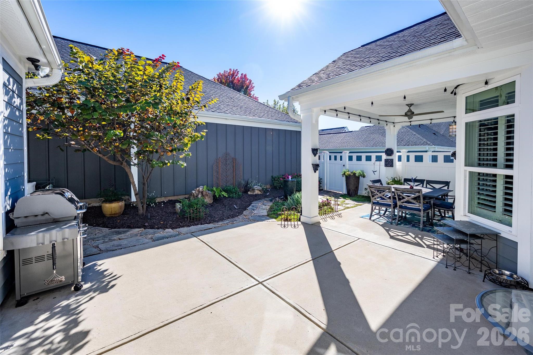 16215 Lakeside Loop Lane Cornelius, NC 28031 - Photo 5 of 48 a view of a chairs and tables in the patio