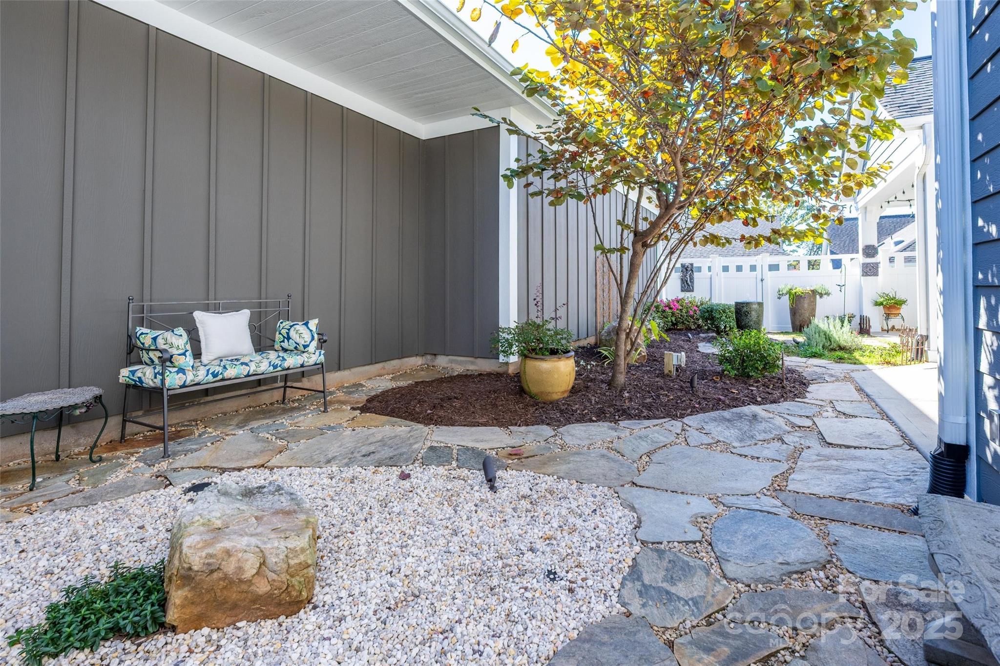 16215 Lakeside Loop Lane Cornelius, NC 28031 - Photo 10 of 48 a view of a backyard with table and chairs