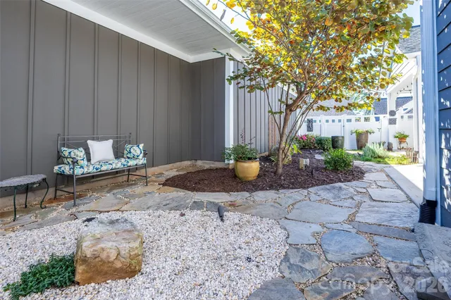 a view of a backyard with table and chairs
