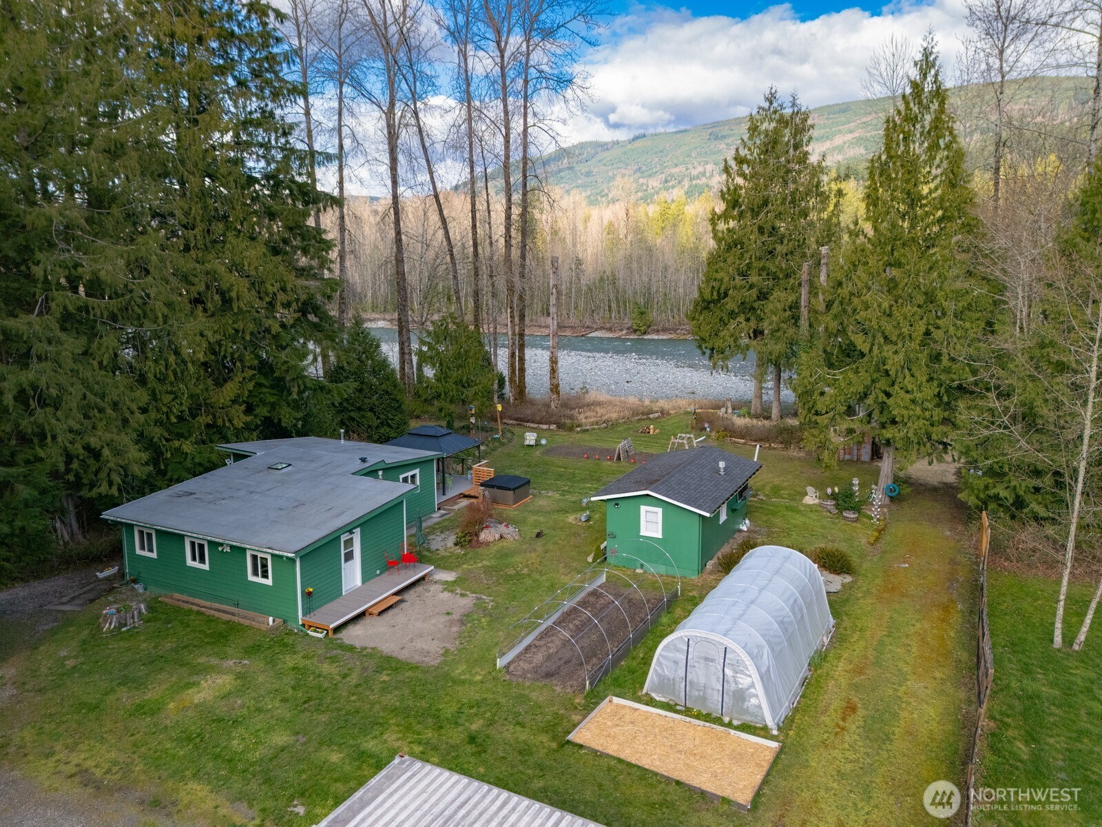 an aerial view of a house with swimming pool garden and patio