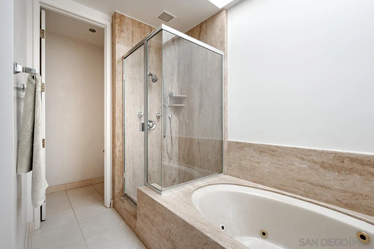 230 West Laurel Street, Unit 1001 San Diego, CA 92101 - Photo 21 of 44 a bathroom with a bathtub and a shower