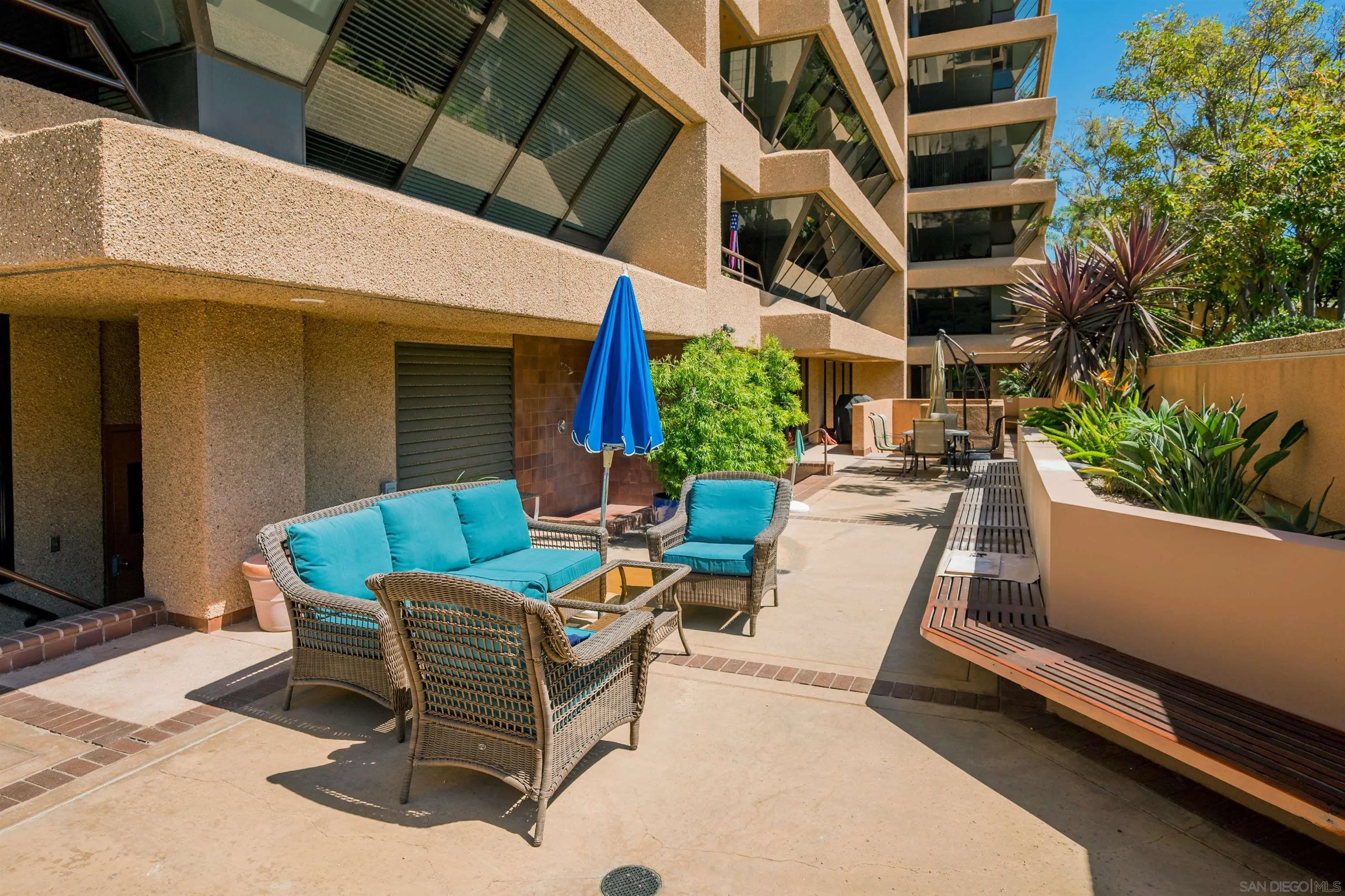 230 West Laurel Street, Unit 1001 San Diego, CA 92101 - Photo 43 of 44 a view of a patio with couches table and chairs and potted plants