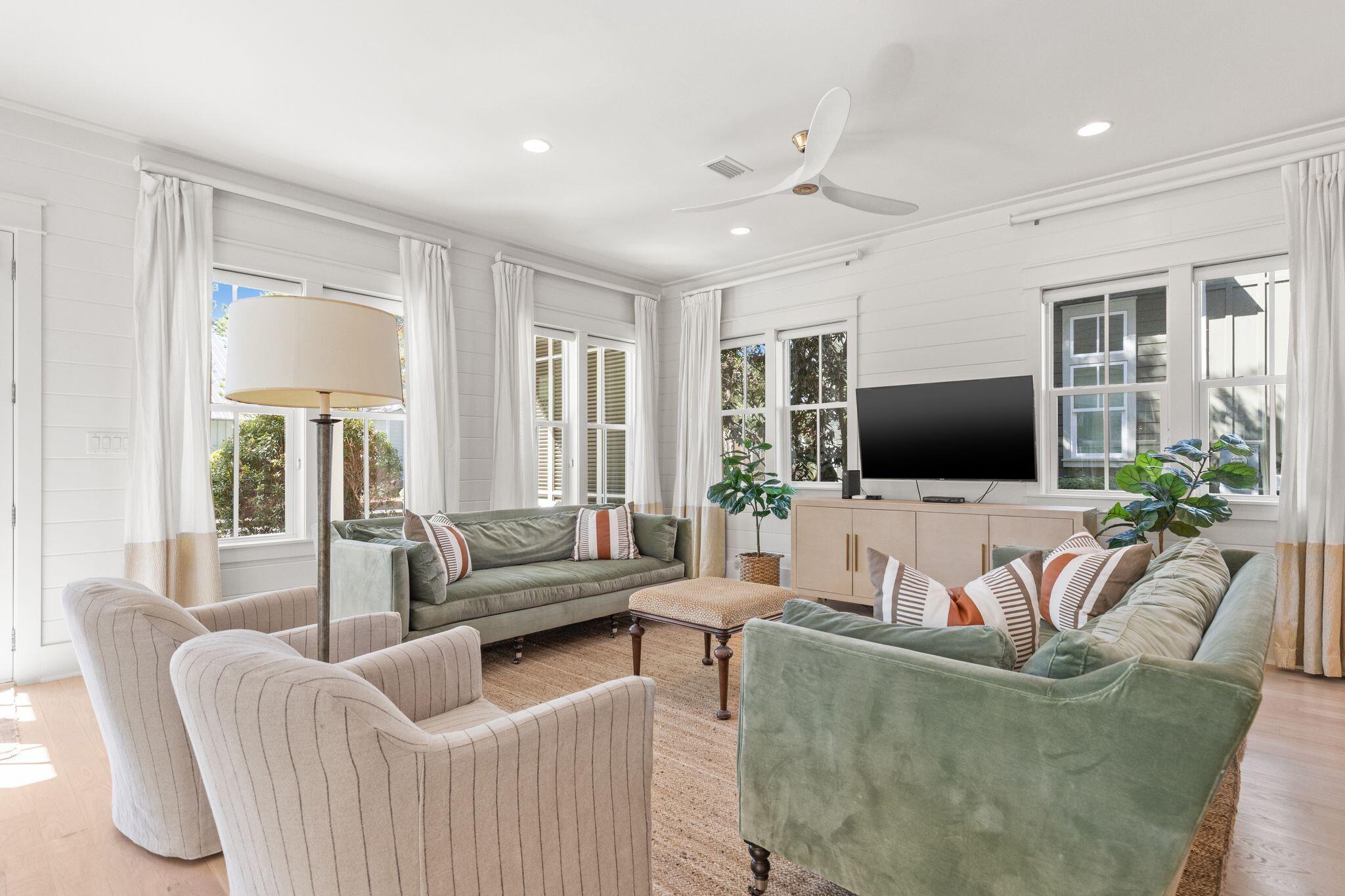 97 Sunflower Street Santa Rosa Beach, FL 32459 - Photo 15 of 86 a living room with furniture and a flat screen tv