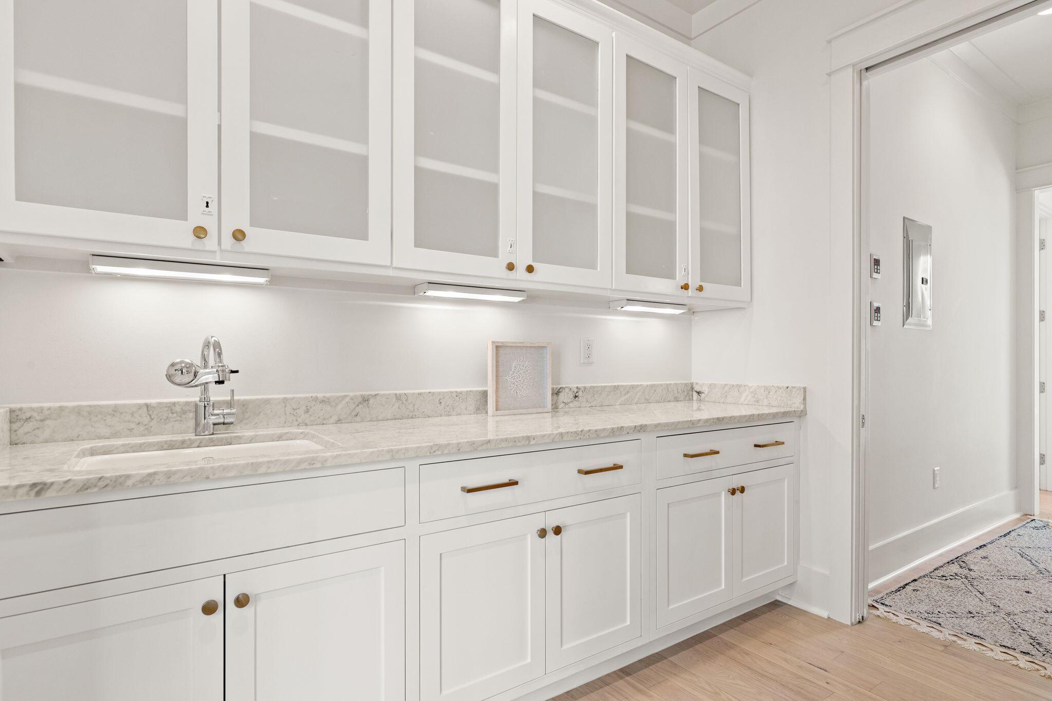 97 Sunflower Street Santa Rosa Beach, FL 32459 - Photo 22 of 86 a kitchen with granite countertop white cabinets and a sink
