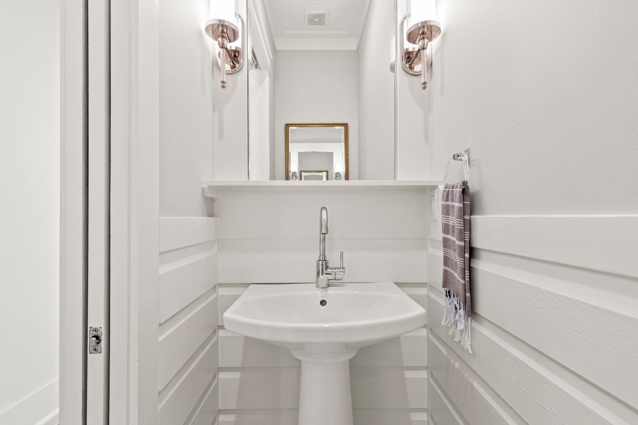 97 Sunflower Street Santa Rosa Beach, FL 32459 - Photo 23 of 86 a bathroom with a sink and a mirror