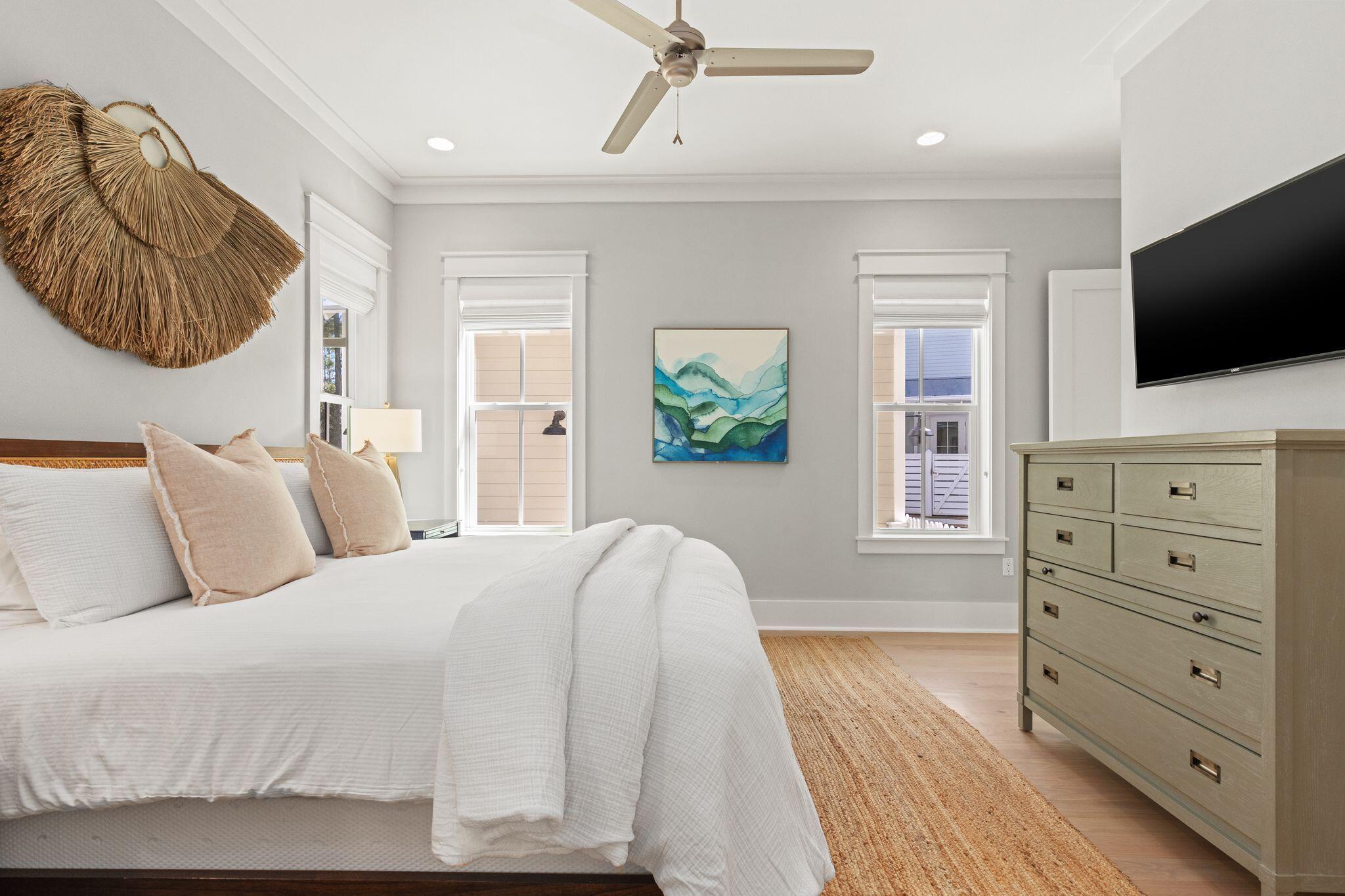 97 Sunflower Street Santa Rosa Beach, FL 32459 - Photo 27 of 86 a bedroom with a large bed and a television