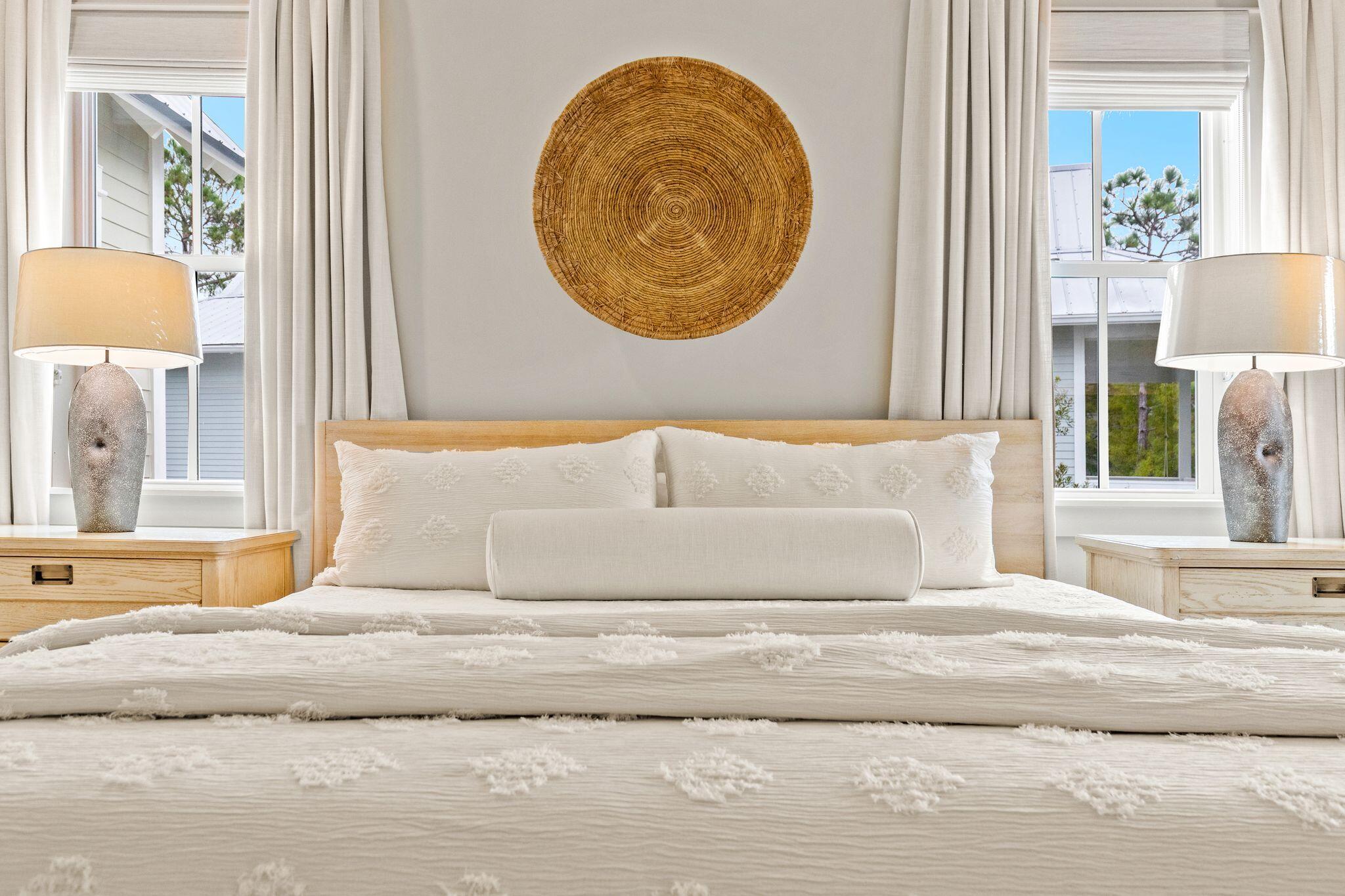 97 Sunflower Street Santa Rosa Beach, FL 32459 - Photo 36 of 86 a bedroom with a bed and a painting on the wall