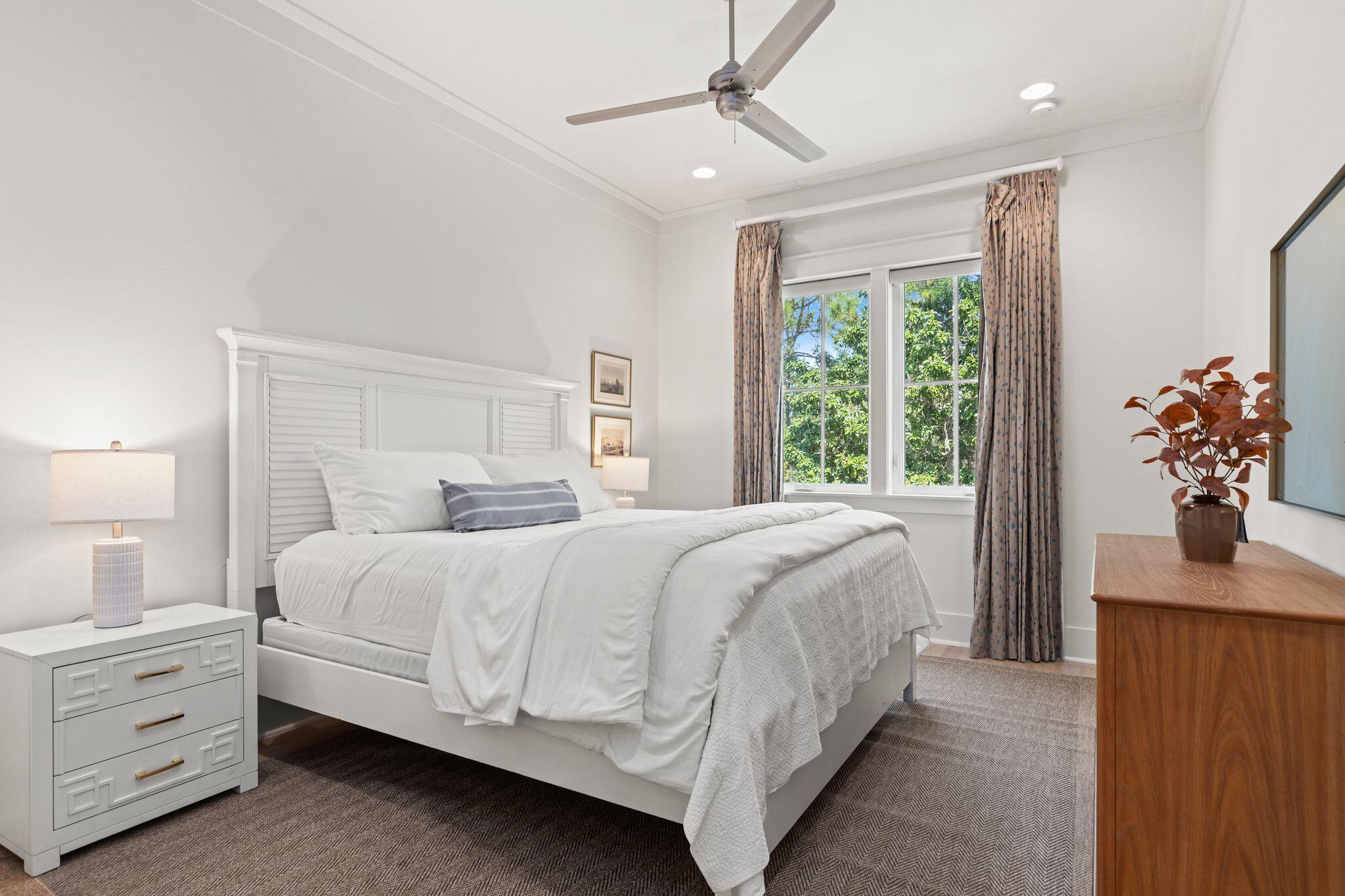 97 Sunflower Street Santa Rosa Beach, FL 32459 - Photo 41 of 86 a bedroom with a bed and a window