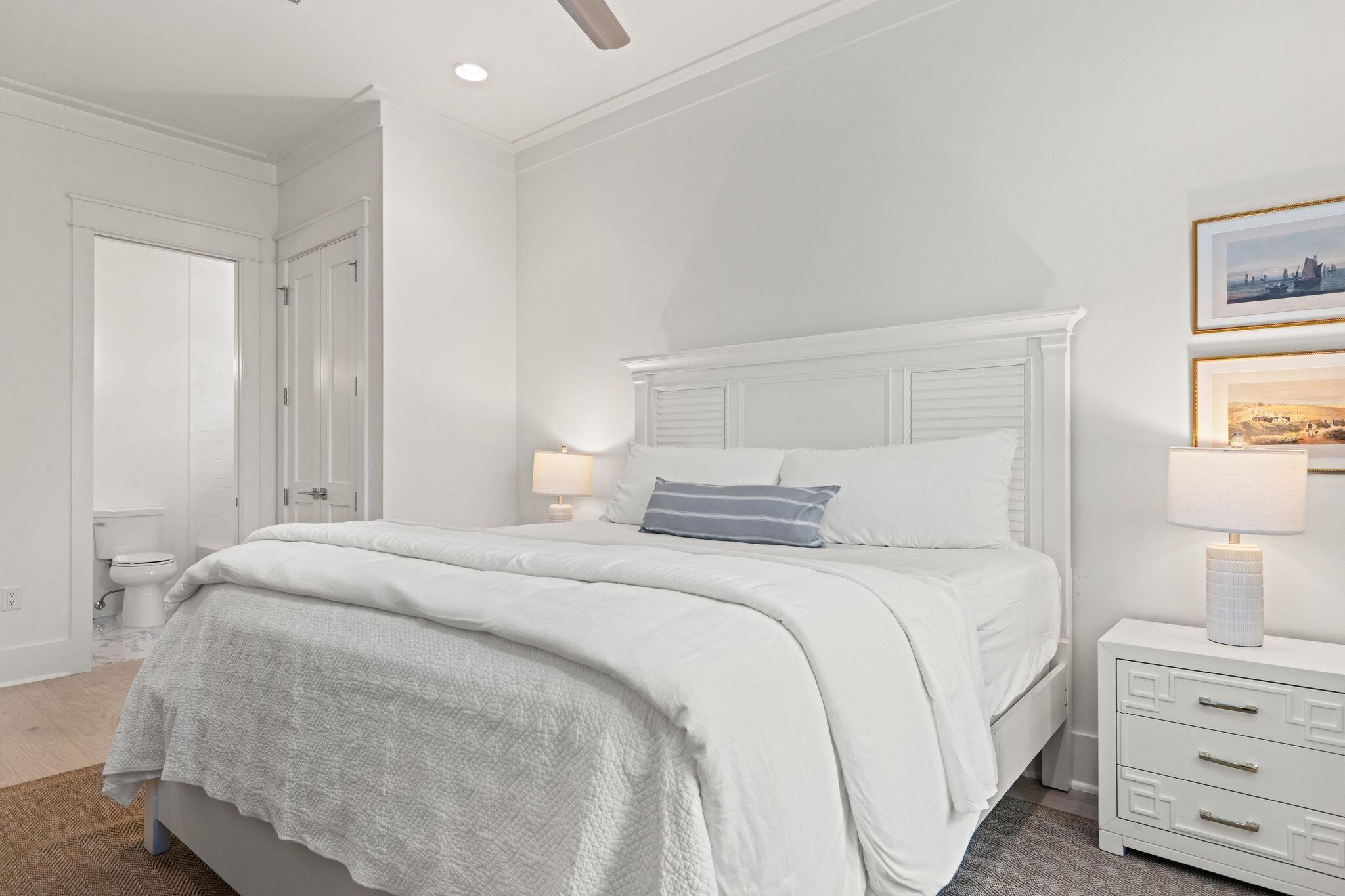 97 Sunflower Street Santa Rosa Beach, FL 32459 - Photo 43 of 86 a bedroom with a bed and a night stand