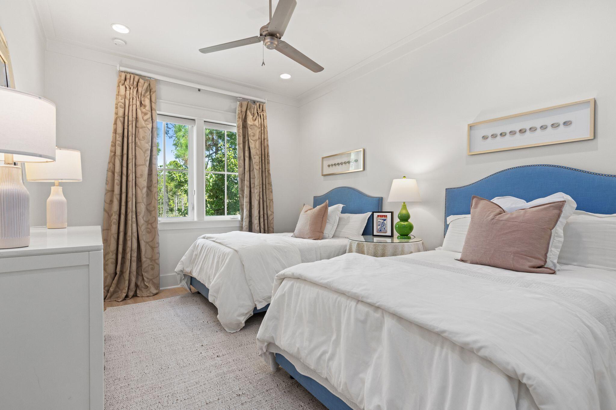 97 Sunflower Street Santa Rosa Beach, FL 32459 - Photo 46 of 86 a bedroom with two beds and a window