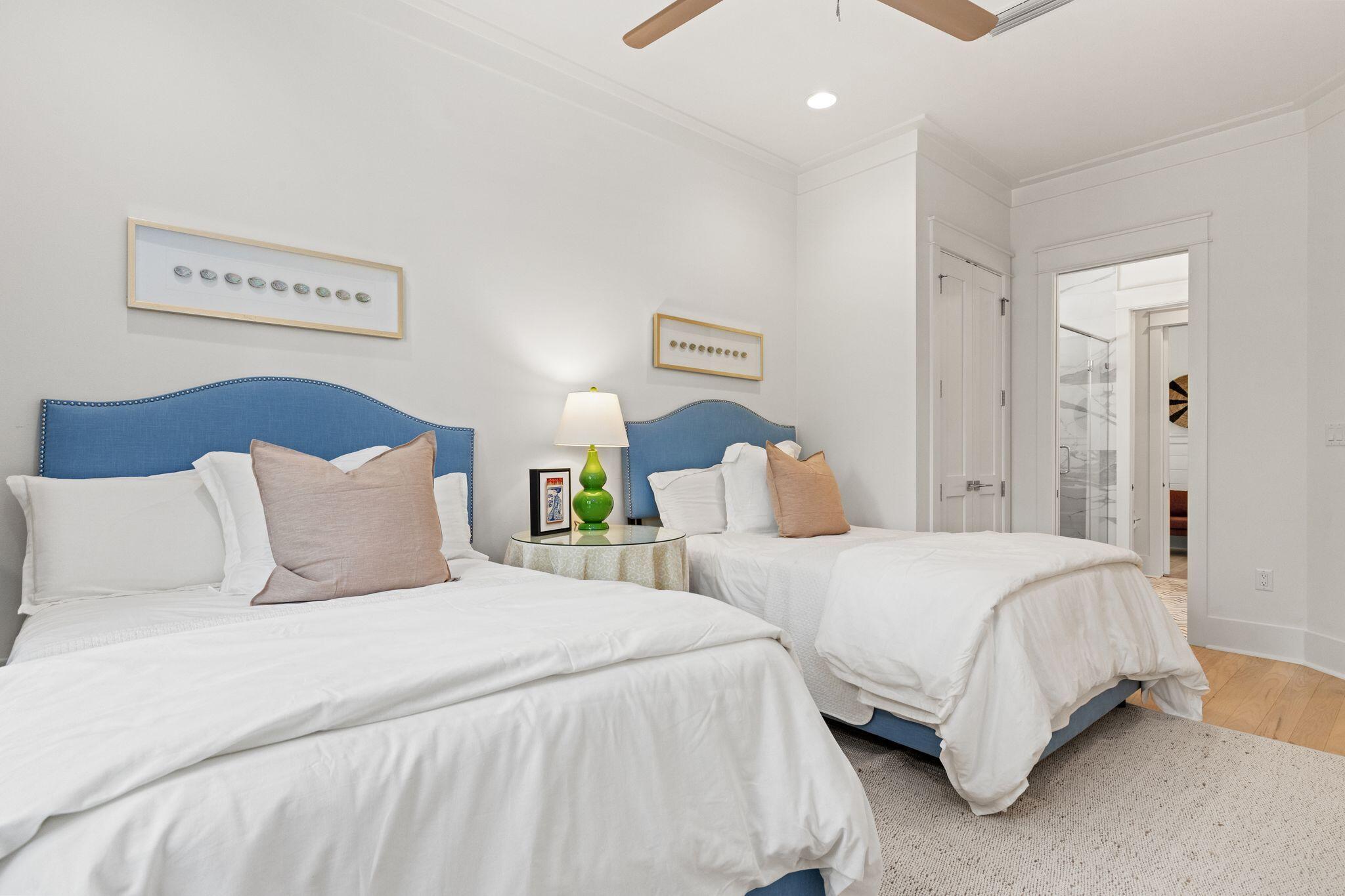 97 Sunflower Street Santa Rosa Beach, FL 32459 - Photo 48 of 86 a bedroom with two bed and a lamp