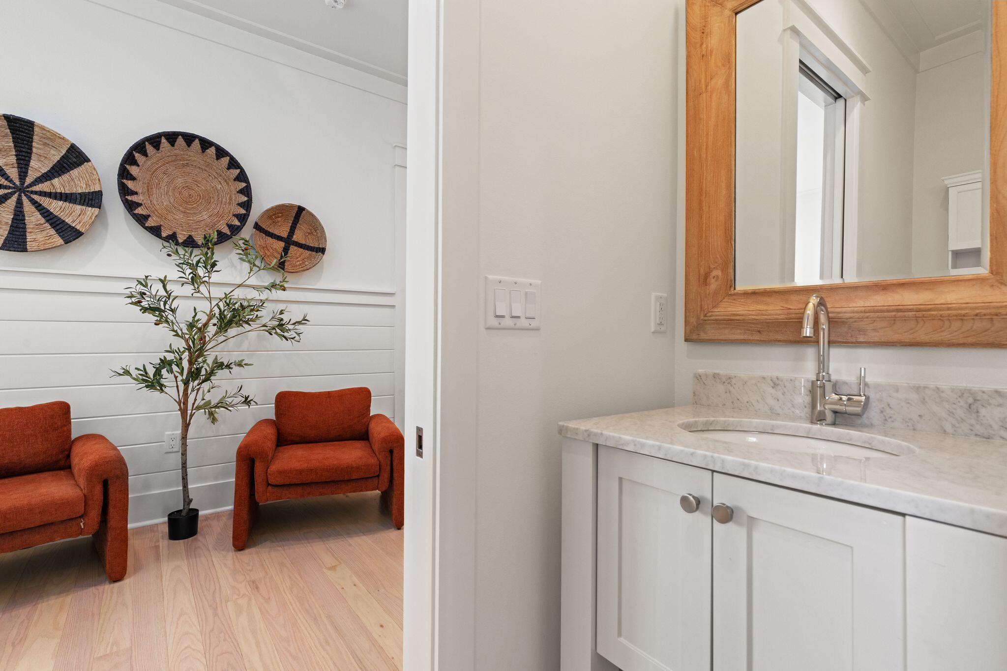 97 Sunflower Street Santa Rosa Beach, FL 32459 - Photo 52 of 86 a bathroom with a sink and a mirror