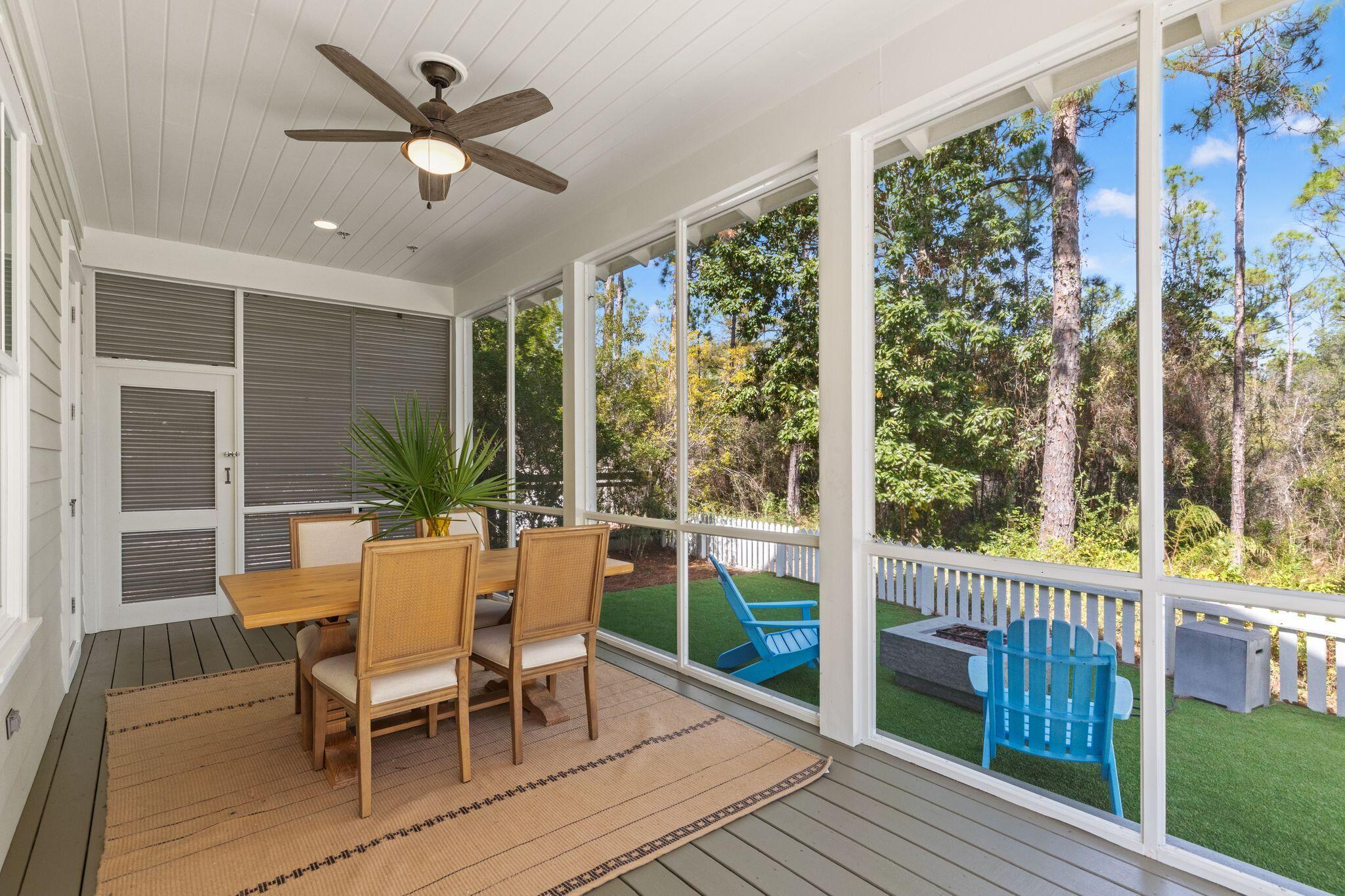 97 Sunflower Street Santa Rosa Beach, FL 32459 - Photo 58 of 86 a view of a dining room with furniture window and wooden floor