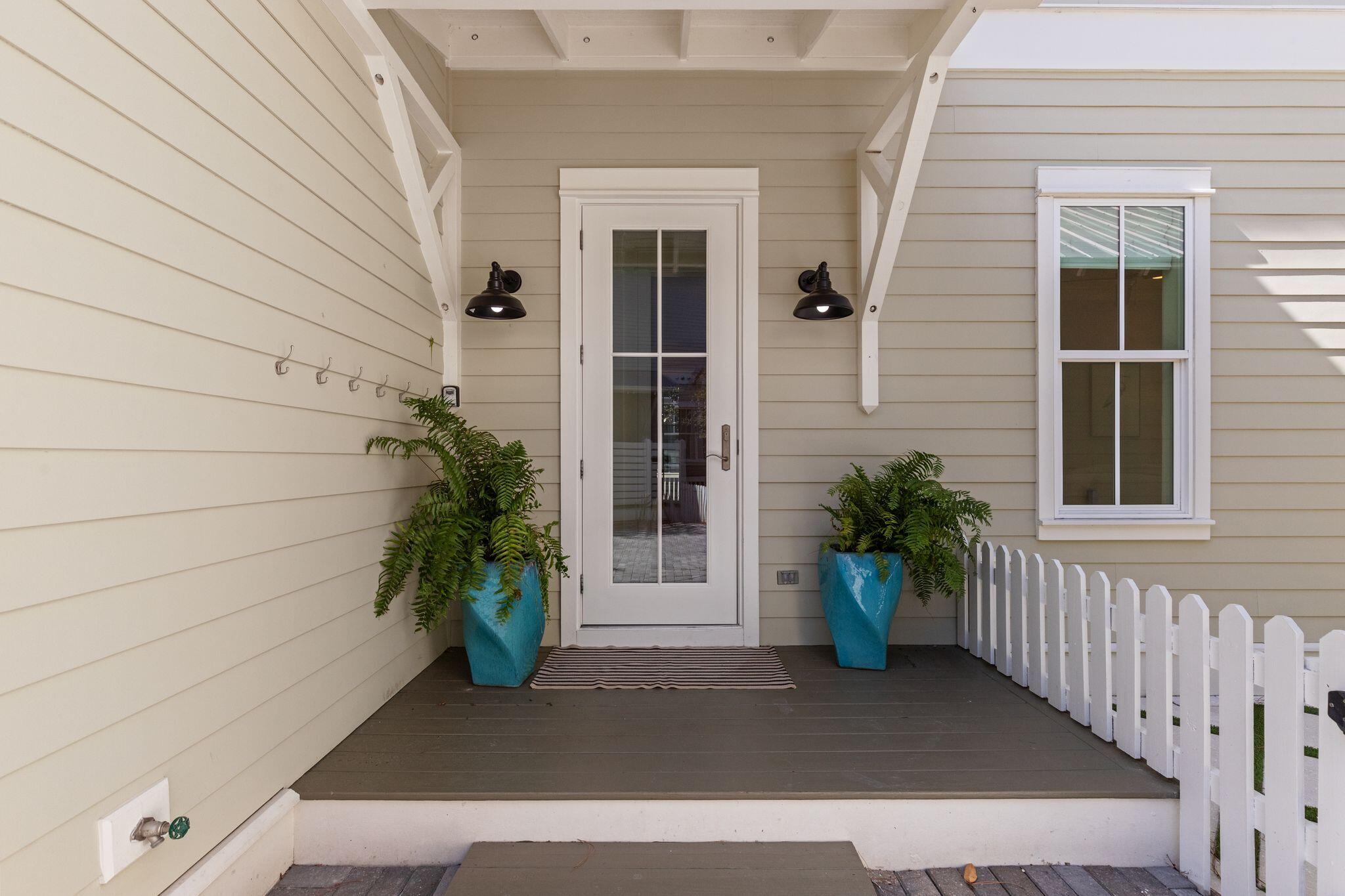 97 Sunflower Street Santa Rosa Beach, FL 32459 - Photo 62 of 86 a potted plant sitting in front of a house