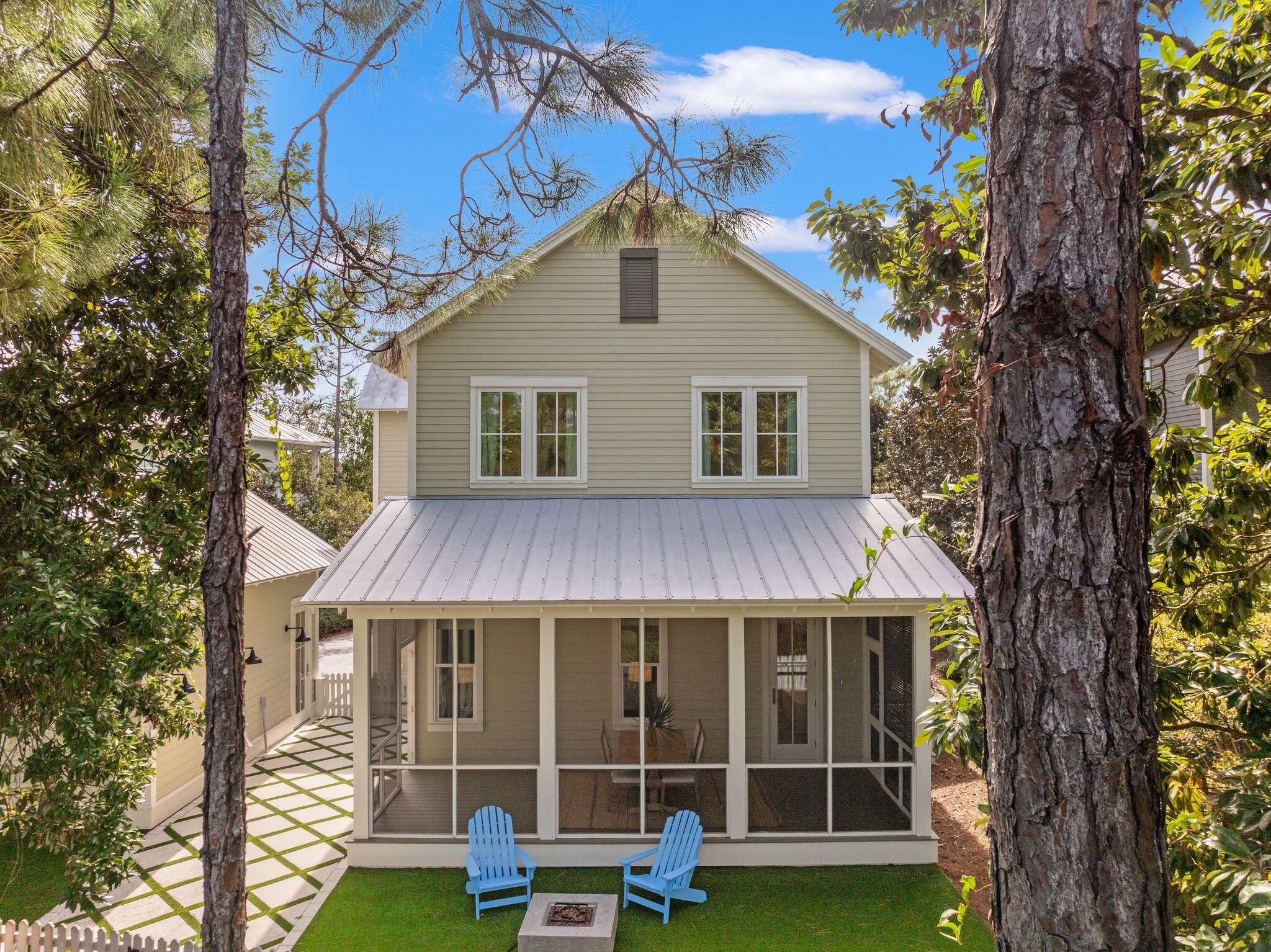 97 Sunflower Street Santa Rosa Beach, FL 32459 - Photo 70 of 86 a view of a house with a yard and porch