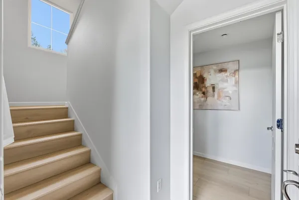 a view of entryway with wooden floor