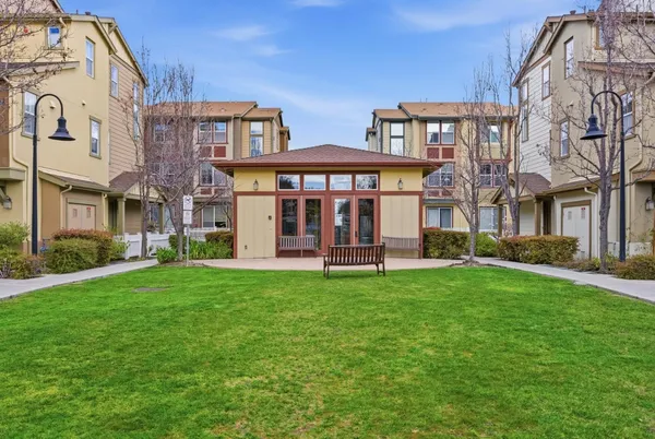 a view of a building with a yard