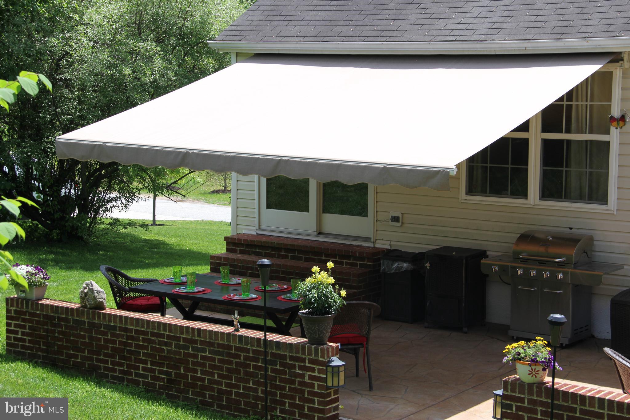 8194 Hicks Road Jessup, MD 20794 - Photo 54 of 57 Patio with Retractable Awning