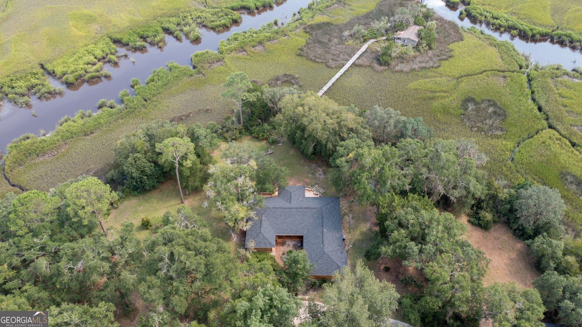 1924 Cedar Court Waverly, GA 31565 - Photo 15 of 78 an aerial view of a house with a yard and lake view