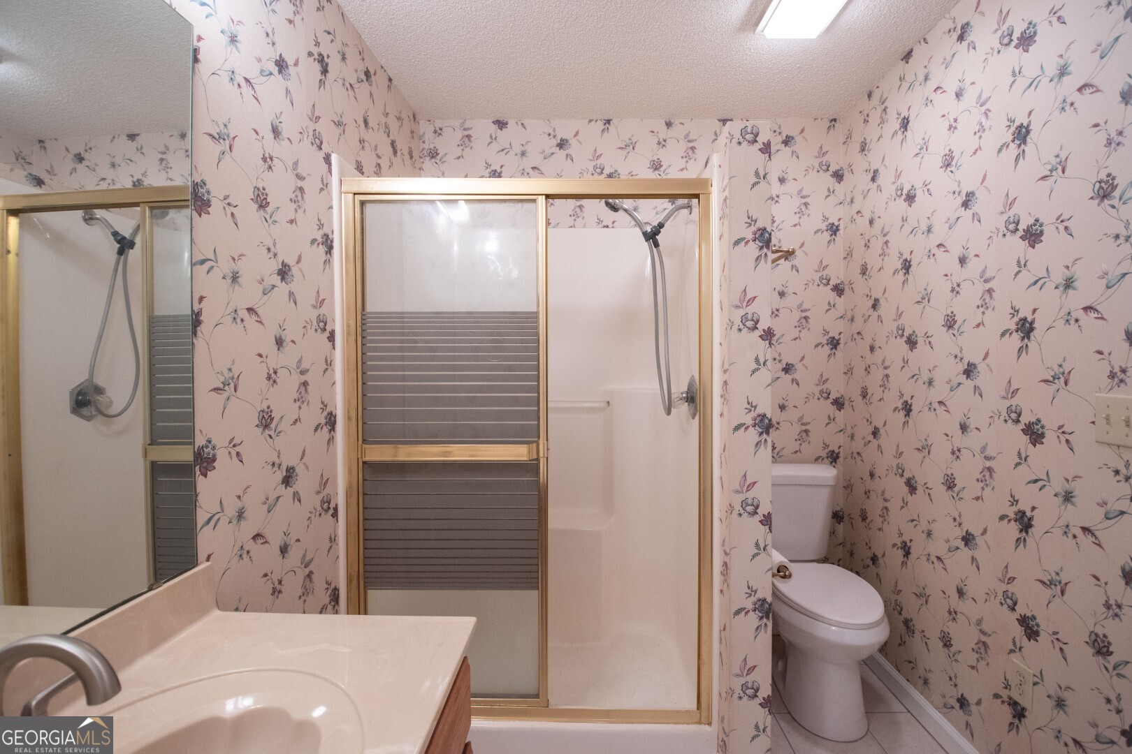 1924 Cedar Court Waverly, GA 31565 - Photo 23 of 78 a bathroom with a sink and toilet