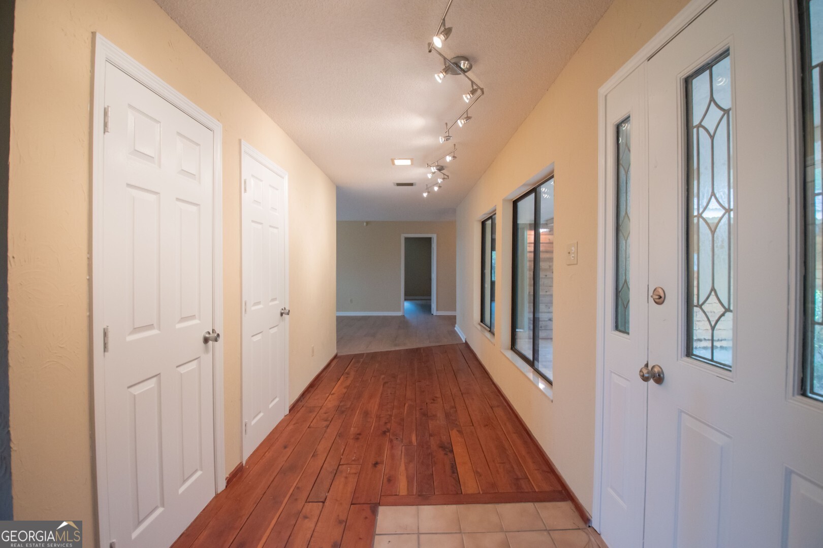 1924 Cedar Court Waverly, GA 31565 - Photo 25 of 78 a view of a hallway with wooden floor and staircase