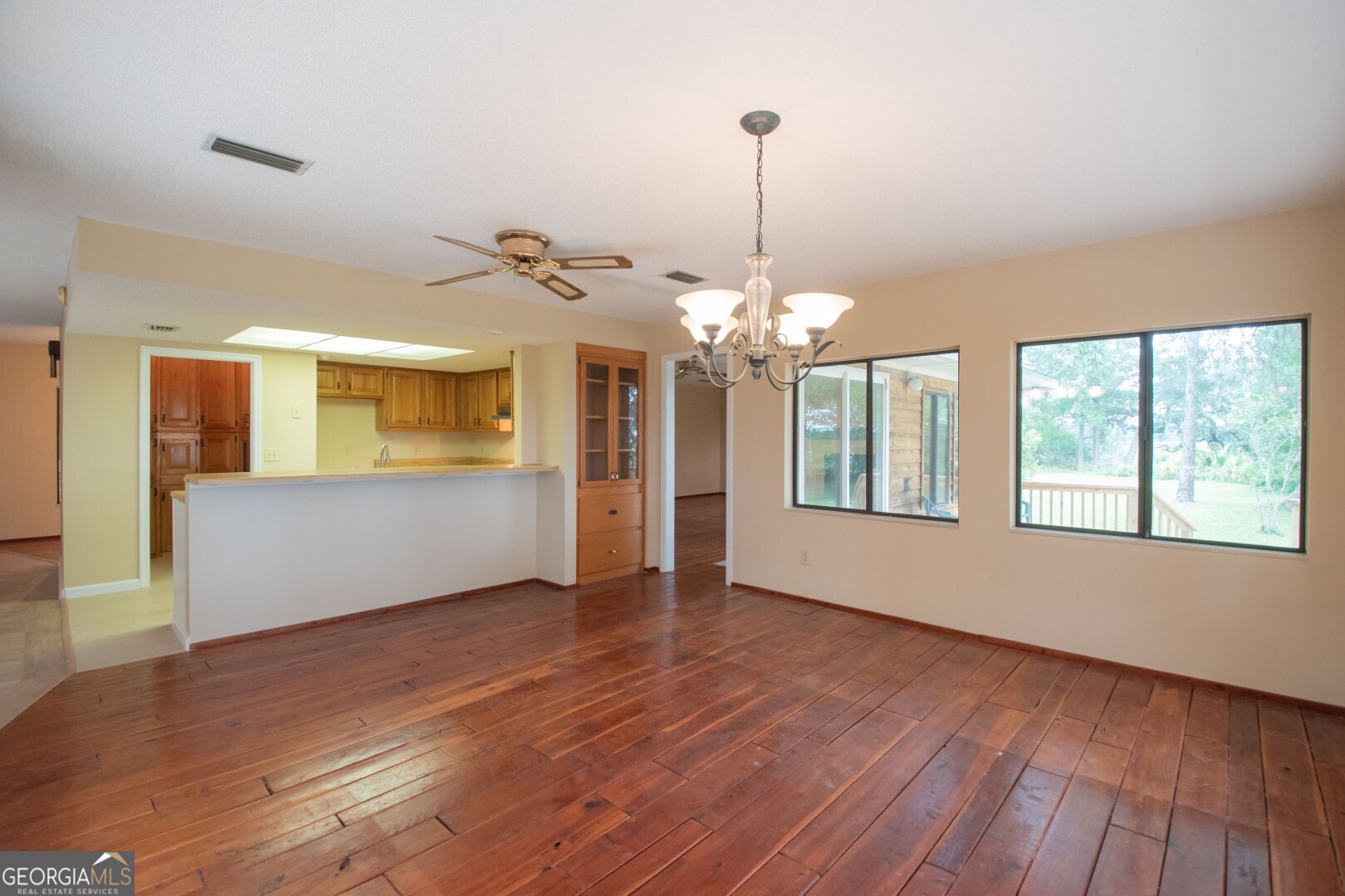 1924 Cedar Court Waverly, GA 31565 - Photo 30 of 78 a view of an empty room with wooden floor and a window