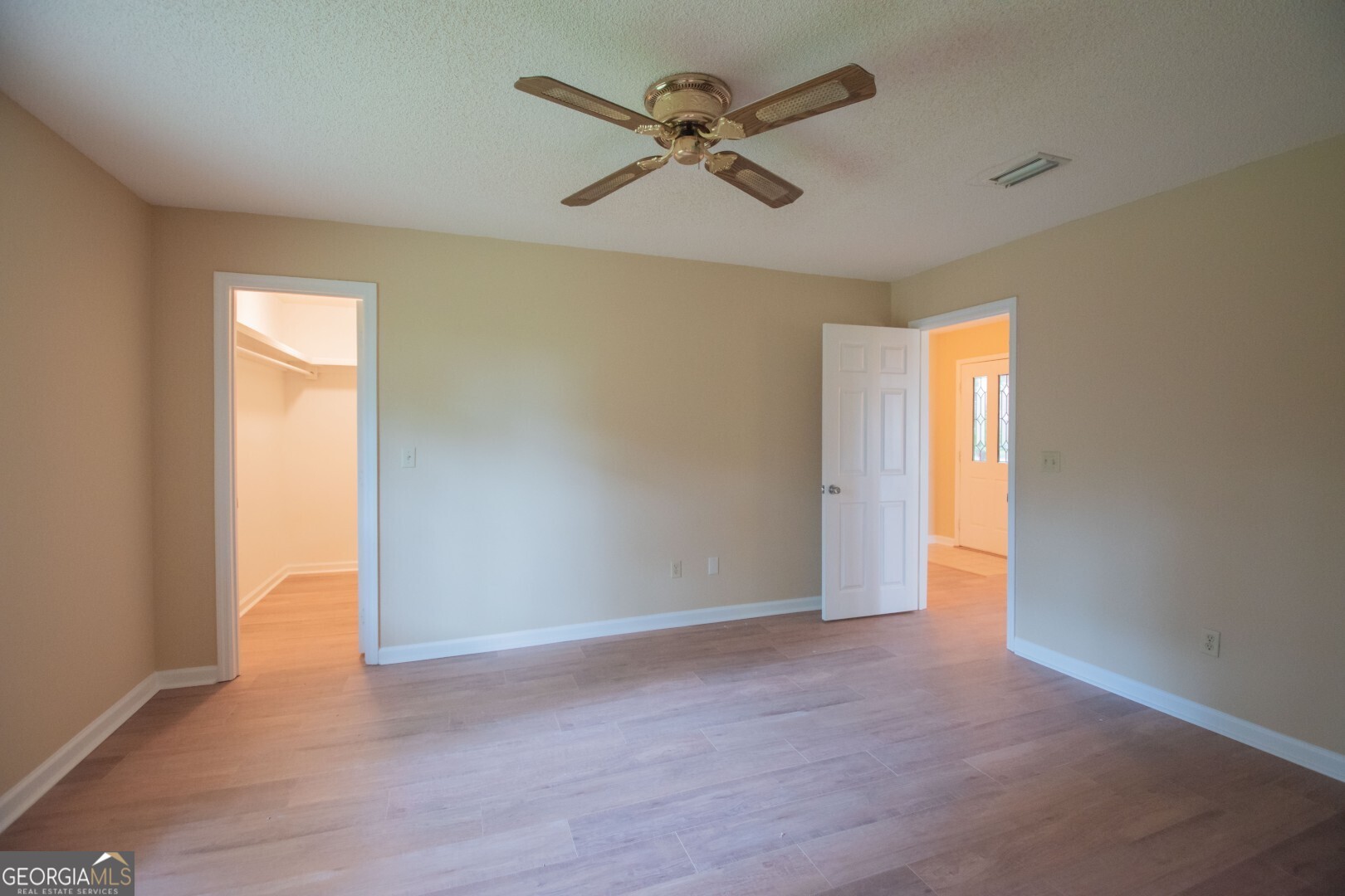 1924 Cedar Court Waverly, GA 31565 - Photo 39 of 78 an empty room with closet and a ceiling fan