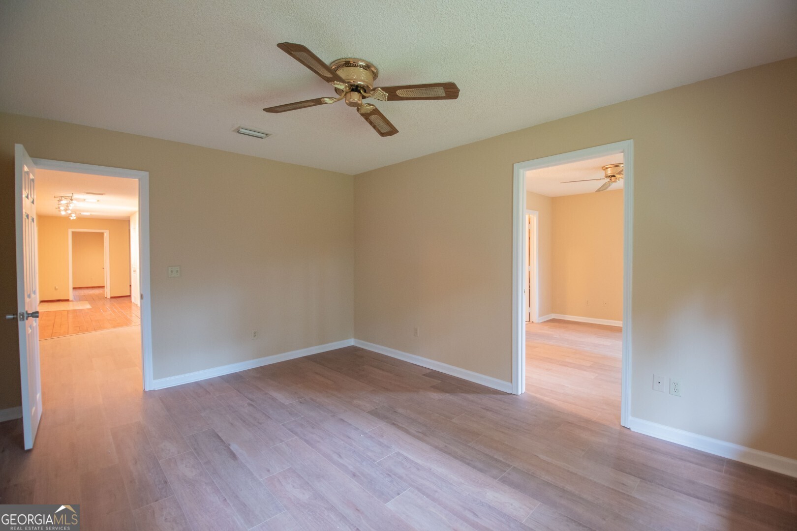 1924 Cedar Court Waverly, GA 31565 - Photo 41 of 78 a view of a room with wooden floor closet and windows