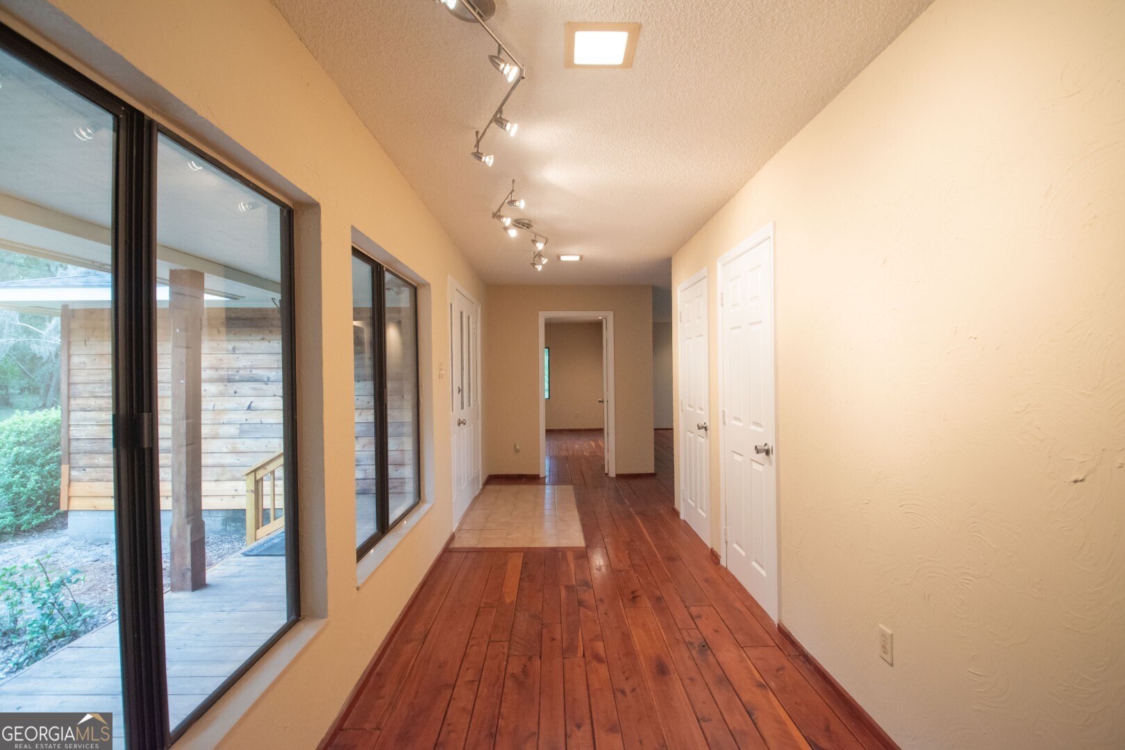 1924 Cedar Court Waverly, GA 31565 - Photo 42 of 78 a view of a hallway with wooden floor