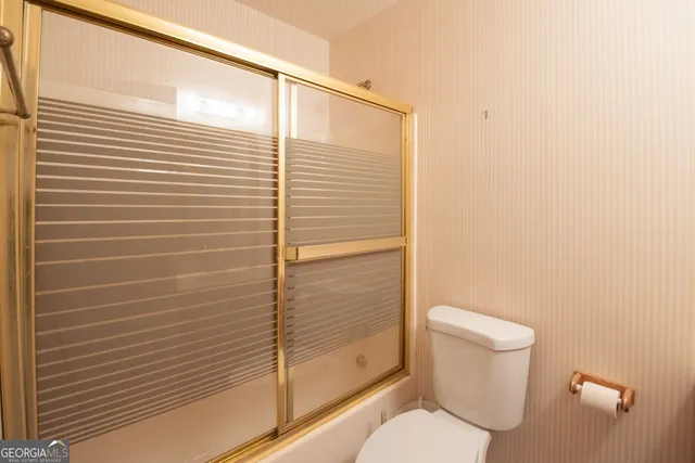 a view of a balcony with wooden floor and stairs