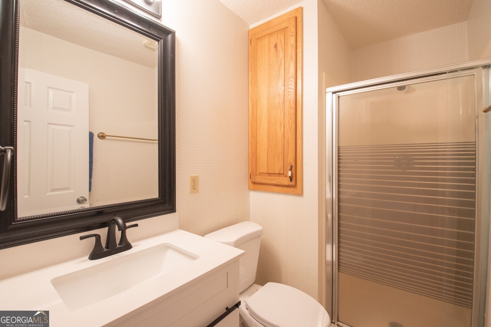 1924 Cedar Court Waverly, GA 31565 - Photo 45 of 78 a bathroom with a sink and a mirror