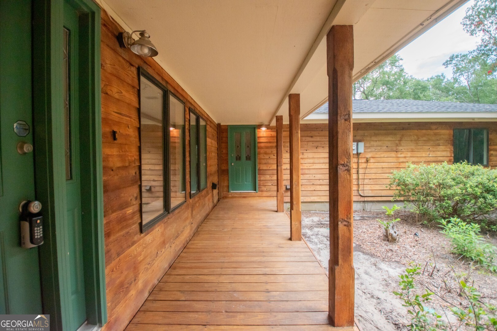 1924 Cedar Court Waverly, GA 31565 - Photo 64 of 78 a view of a balcony with wooden floor and stairs