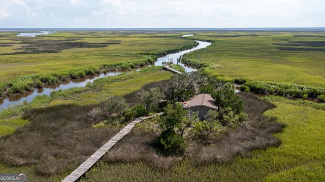 an aerial view of a house with swimming pool