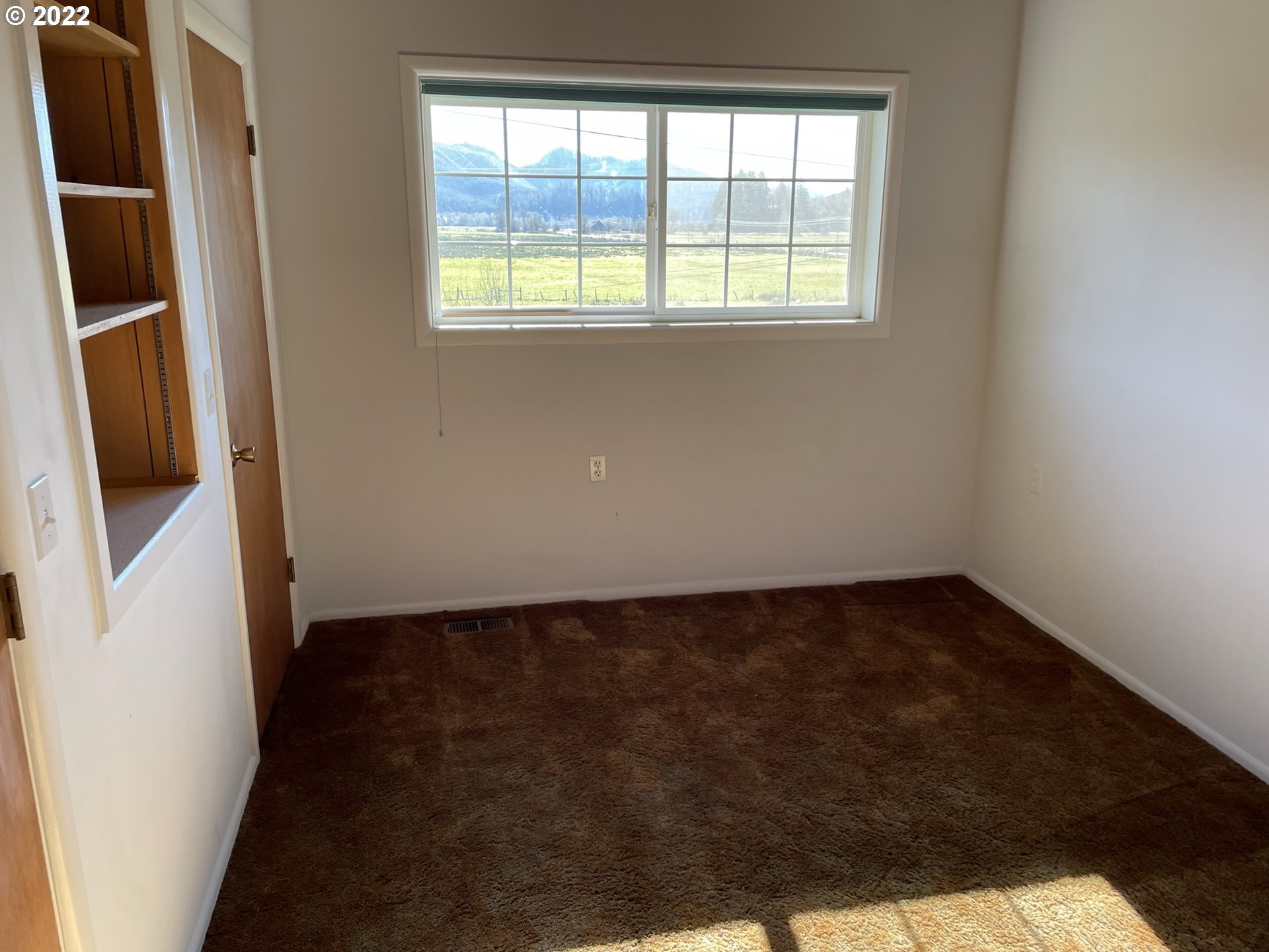 19975 Highway 36 Blachly, OR 97412 - Photo 14 of 32 a view of an empty room and window