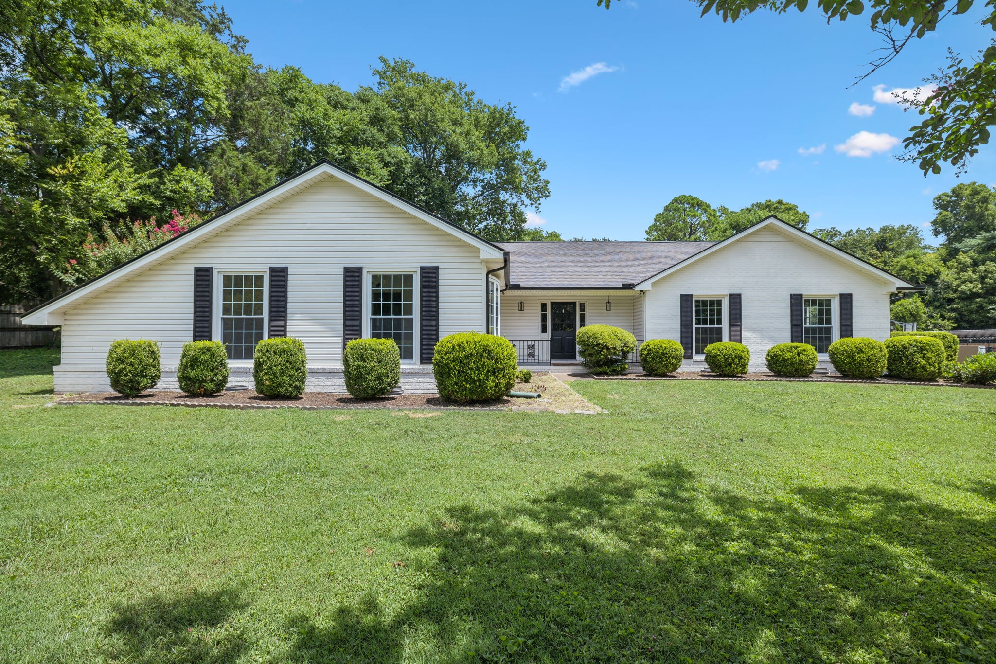 1103 Virginia Avenue Murfreesboro, TN 37130 - Photo 1 of 66 a view of a house with a big yard and potted plants