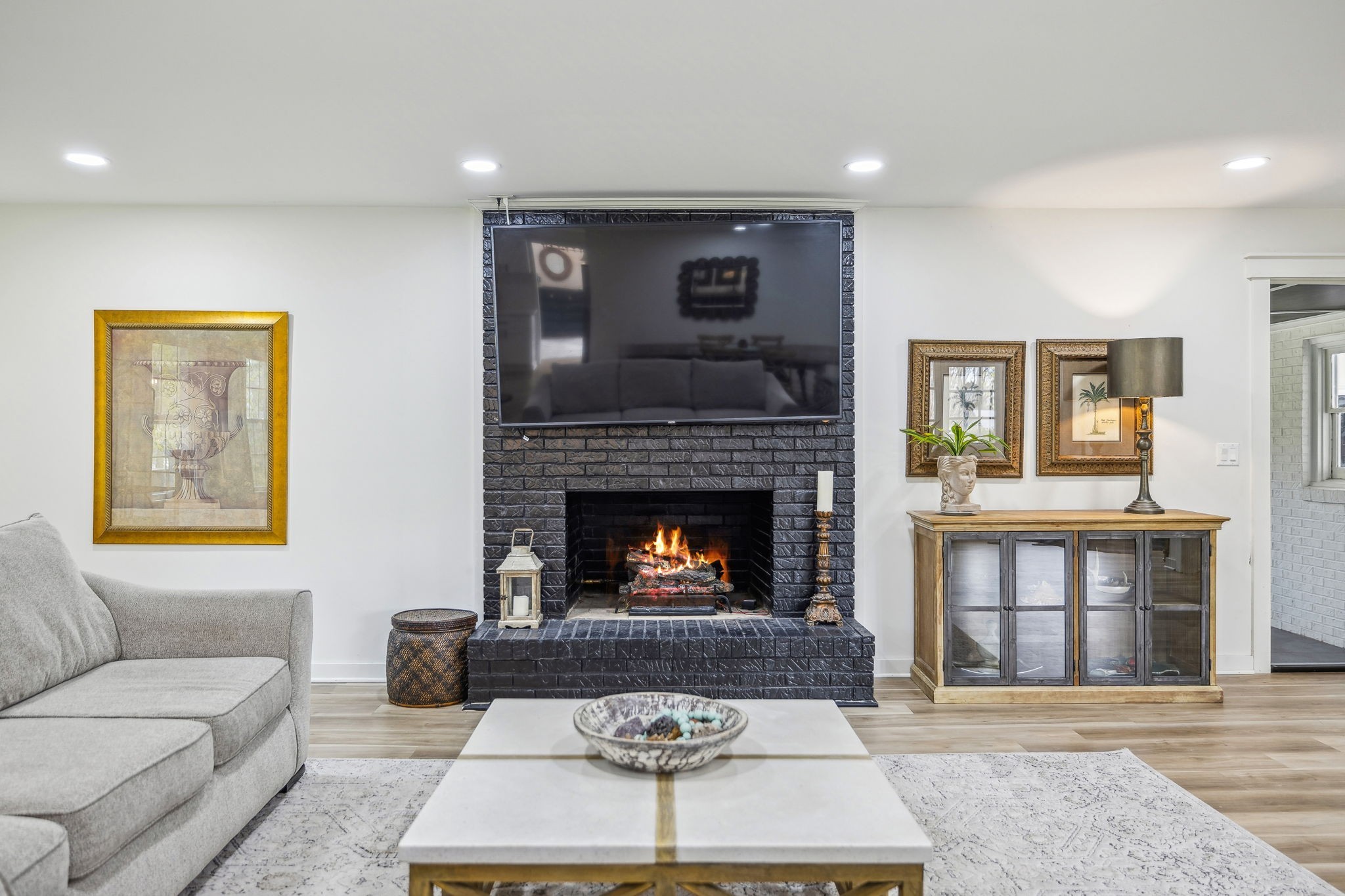 1103 Virginia Avenue Murfreesboro, TN 37130 - Photo 17 of 66 a living room with furniture and a fireplace