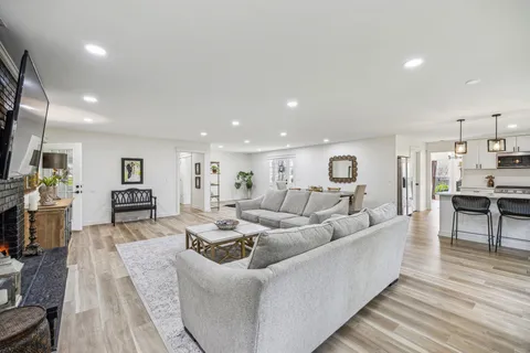 a kitchen with white cabinets stainless steel appliances and sink