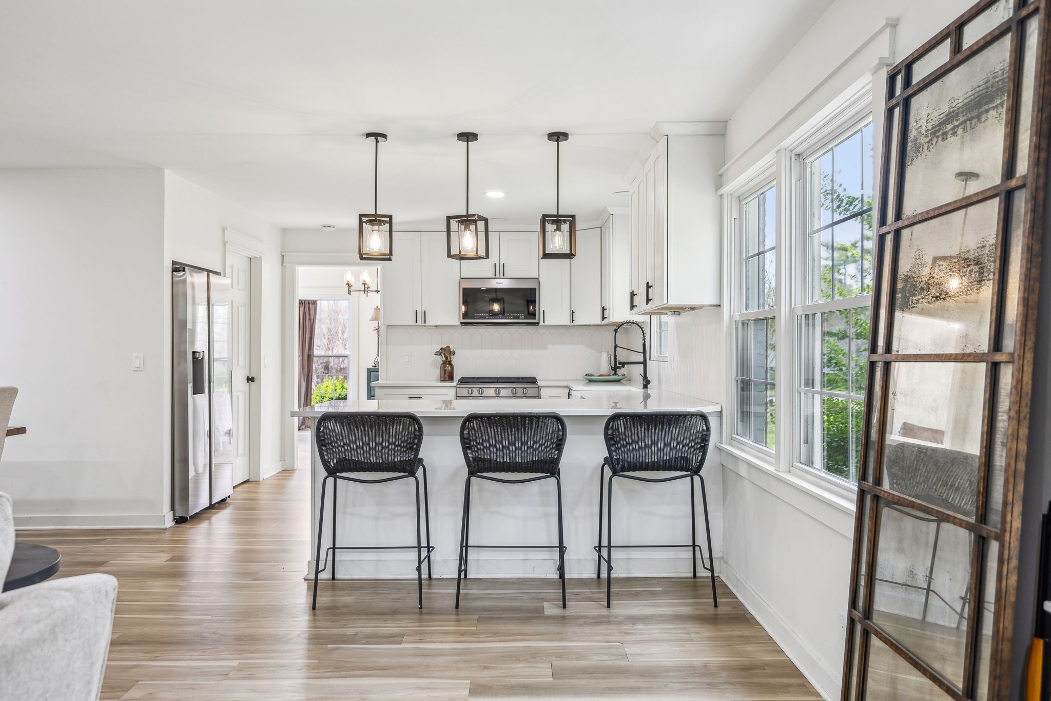 1103 Virginia Avenue Murfreesboro, TN 37130 - Photo 23 of 66 a view of kitchen with stainless steel appliances granite countertop dining table chairs and a wooden floor