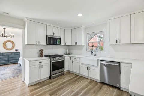 a bedroom with a bed and cabinets