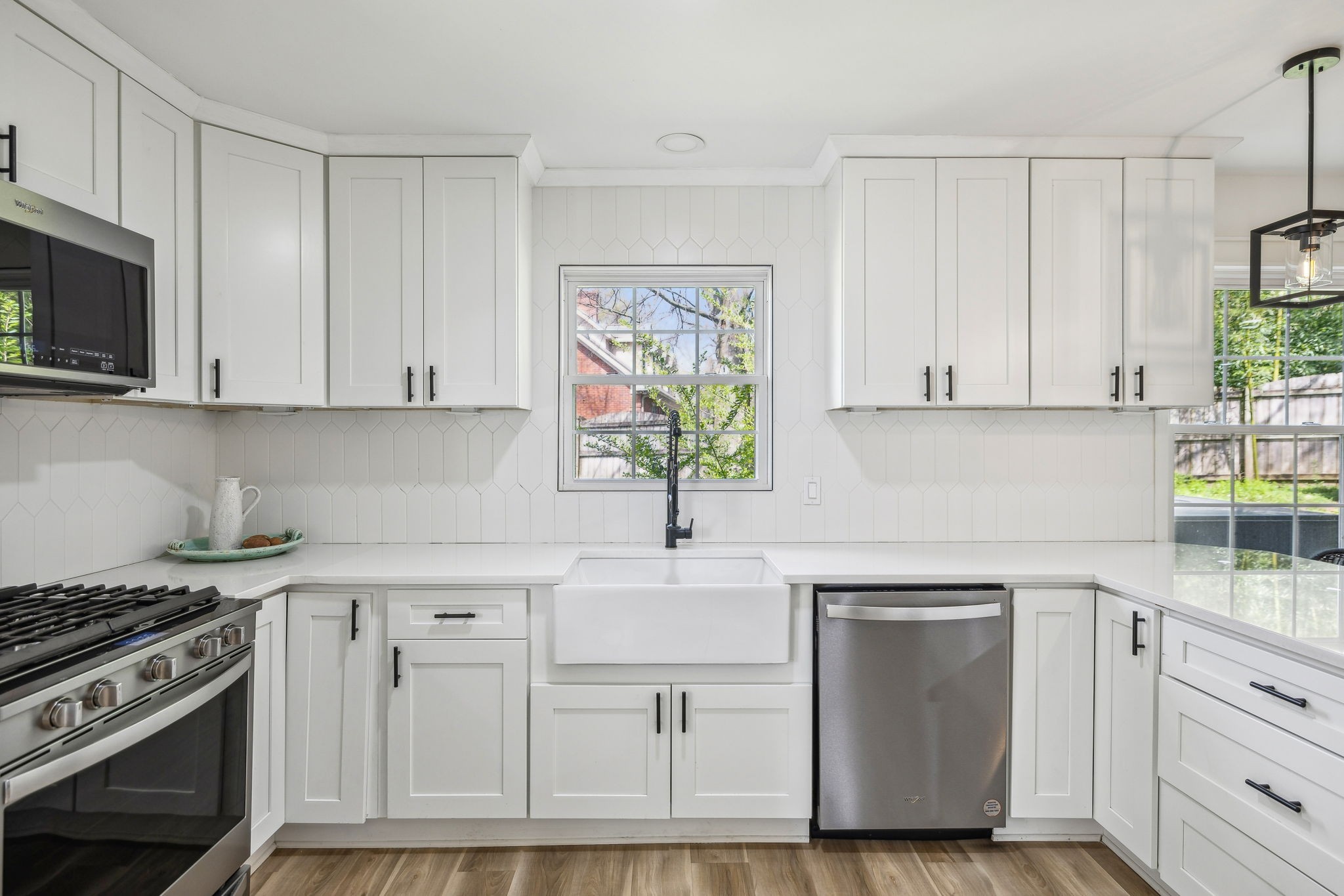 1103 Virginia Avenue Murfreesboro, TN 37130 - Photo 25 of 66 a kitchen with white cabinets and white appliances