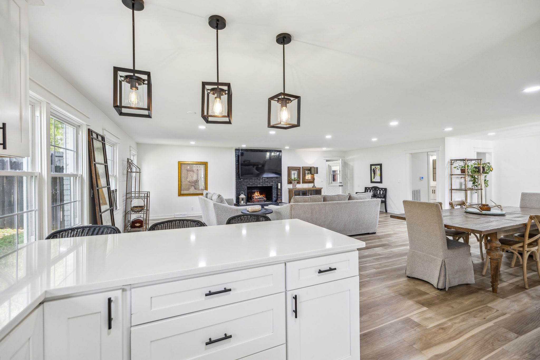 1103 Virginia Avenue Murfreesboro, TN 37130 - Photo 28 of 66 a kitchen with stainless steel appliances kitchen island granite countertop a sink a counter space and living room view