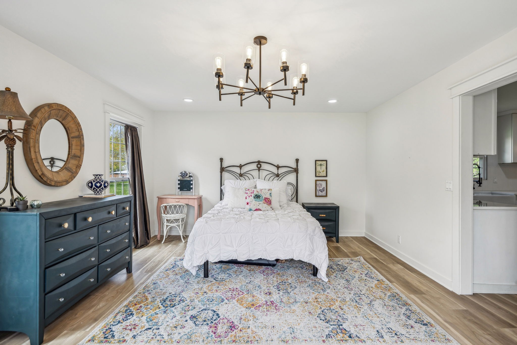 1103 Virginia Avenue Murfreesboro, TN 37130 - Photo 36 of 66 a bedroom with a bed and a chandelier