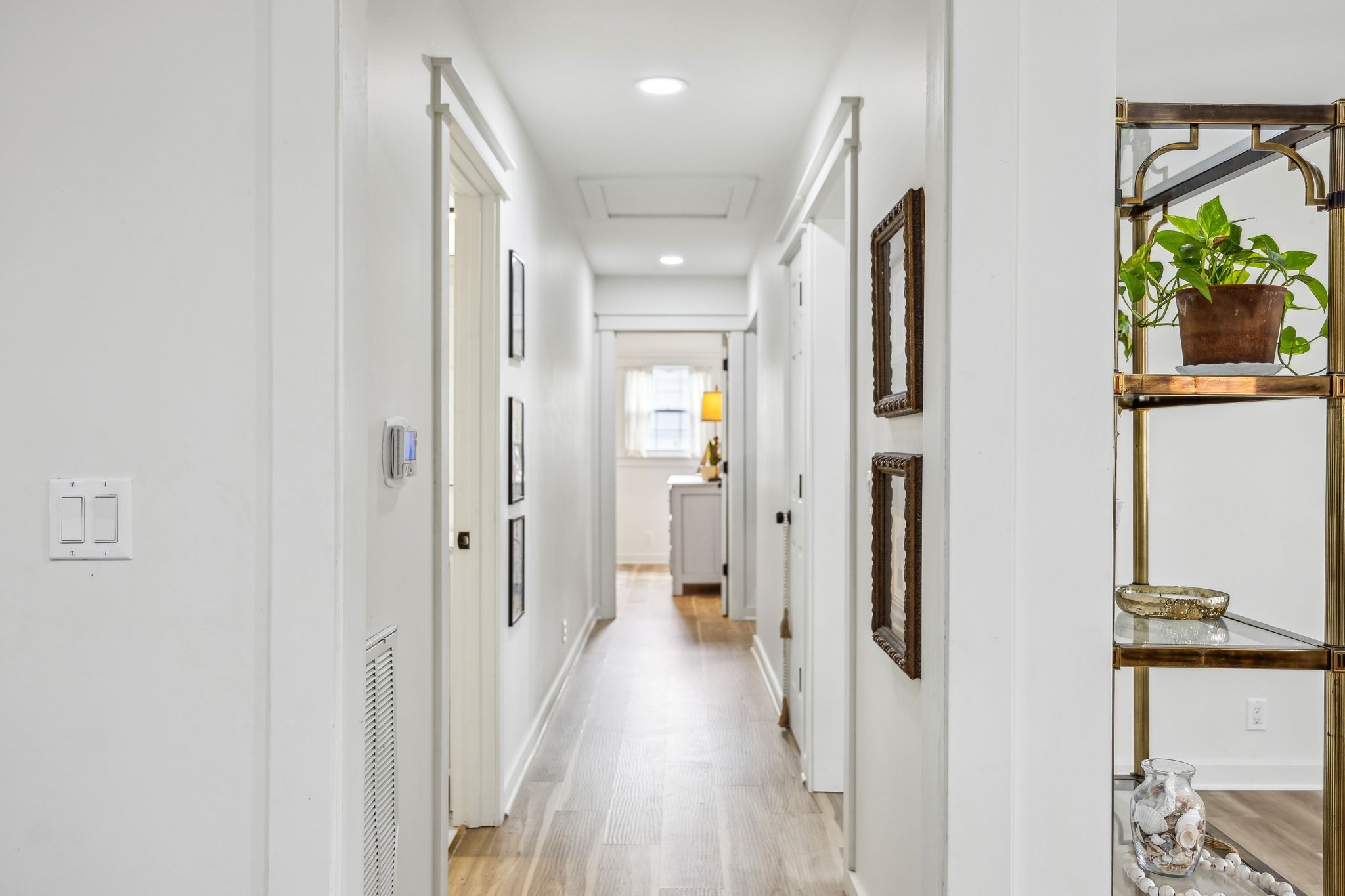 1103 Virginia Avenue Murfreesboro, TN 37130 - Photo 38 of 66 a view of a hallway with wooden floor and a bathroom