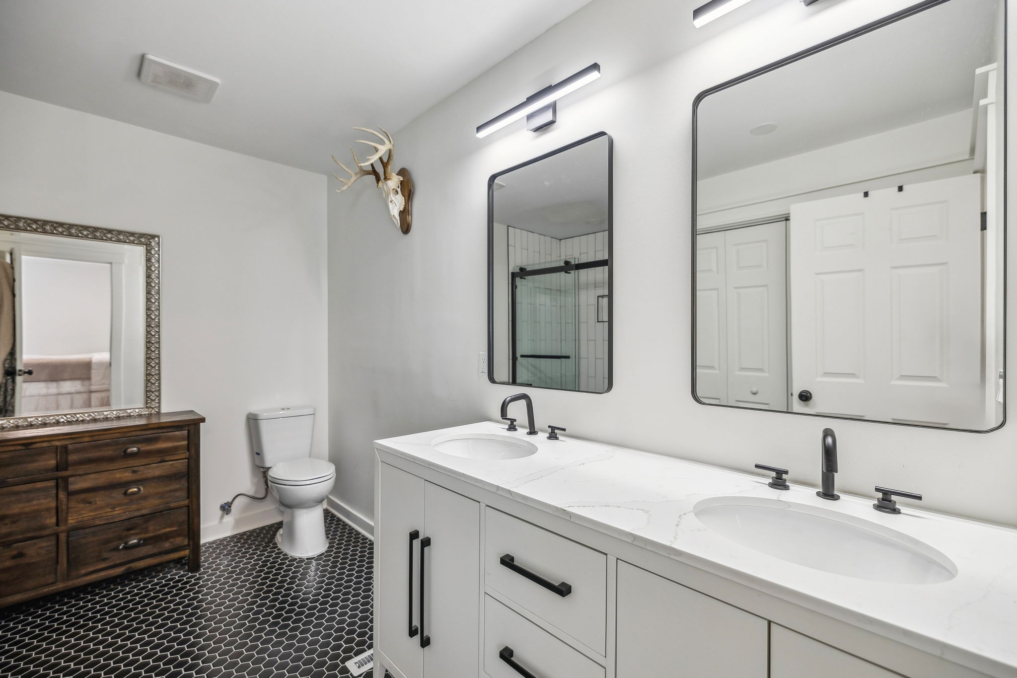 1103 Virginia Avenue Murfreesboro, TN 37130 - Photo 41 of 66 a bathroom with a sink a toilet a mirror and shower